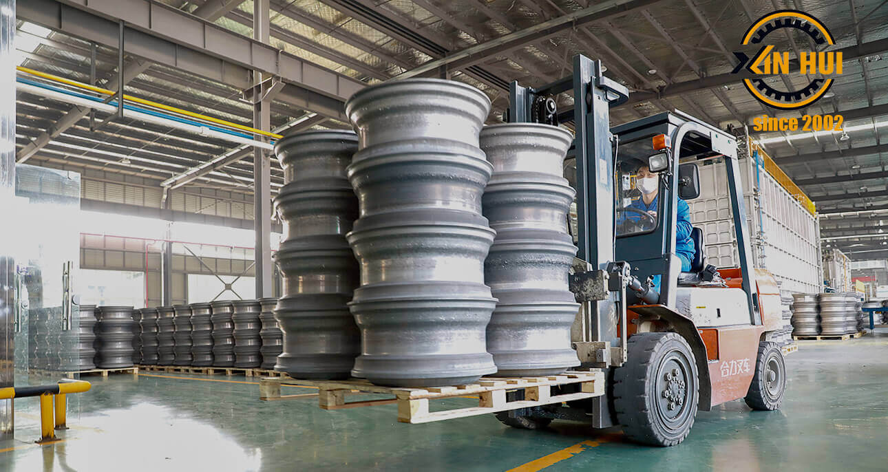 xing hui wheels company transporting car rims over warehouse